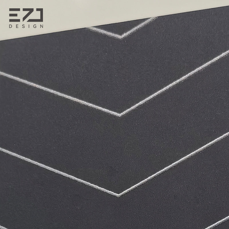 Matte dark gray acrylic surface with geometric line detail