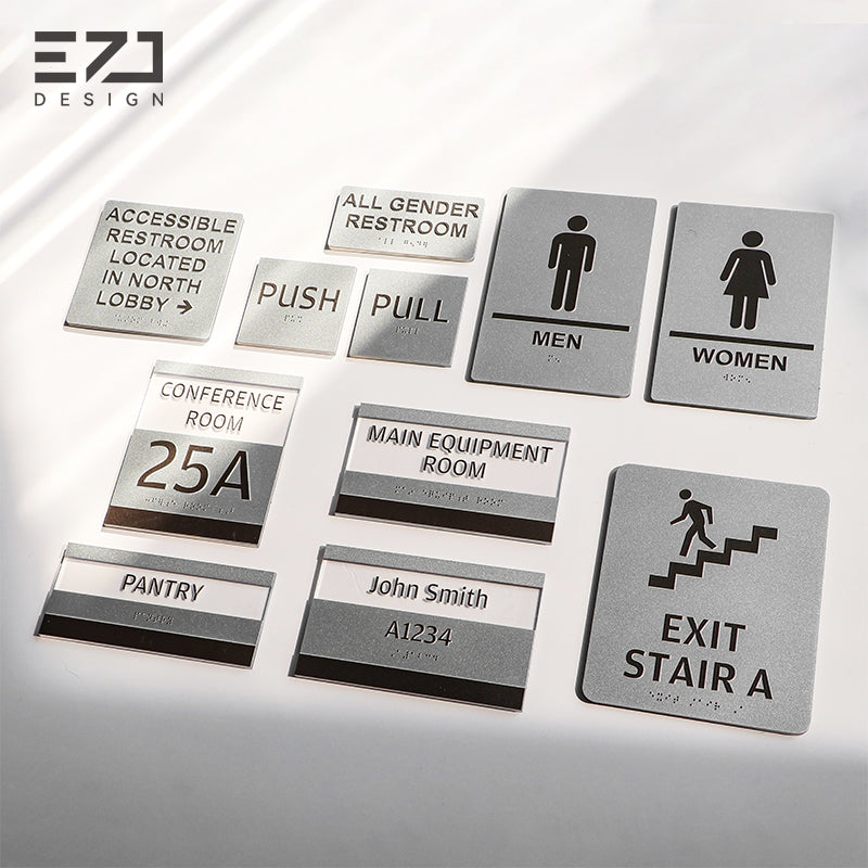 Matching silver-painted acrylic Braille signs for commercial interior signage projects