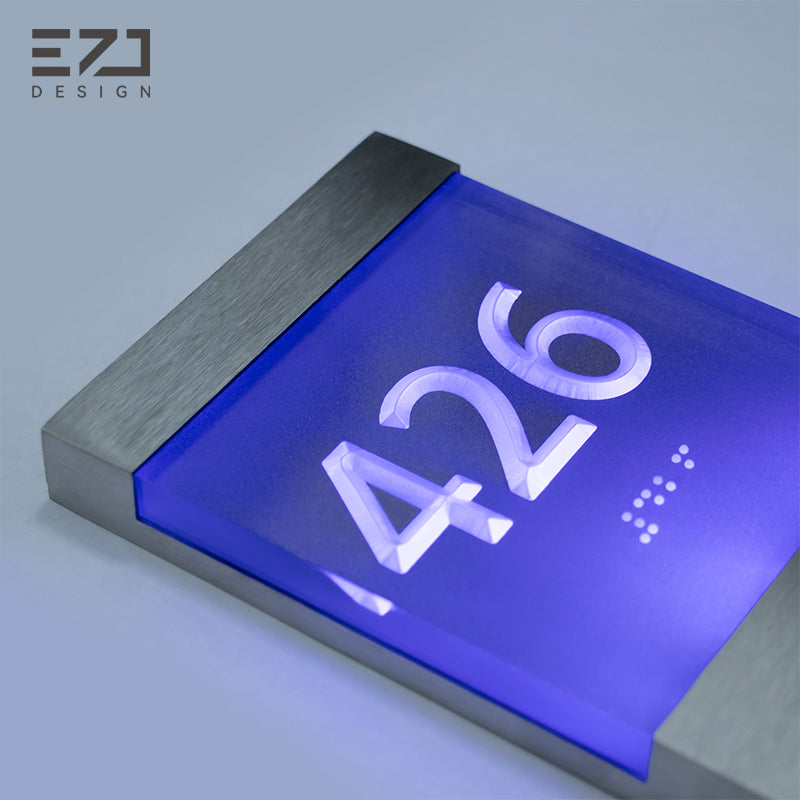 Raised acrylic room number detail on illuminated hotel sign